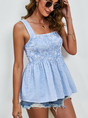 Blue gingham peplum tank top with smocked bodice and square neckline.