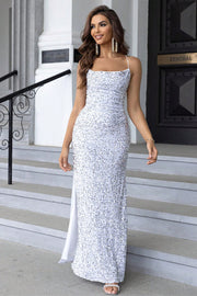 White sequin cami gown with spaghetti straps and a high slit.