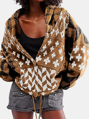 Geometric patchwork knit cardigan in brown with white and black patterns, featuring a buttoned front and shawl collar.