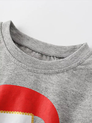 Gray baby pajama top with Santa graphic detail and ruffled puff sleeves.