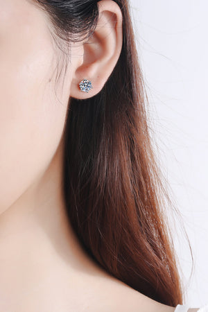 Silver six-prong solitaire stud earrings with a sparkling stone detail.