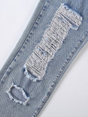 Light wash denim jeans with shredded knee detail and distressed rips.