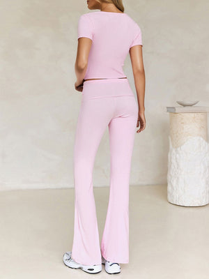 Ribbed blush pink lounge set with flare leg pants and short sleeve top.