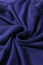 Navy loungewear set fabric detail showing soft texture and draped folds.