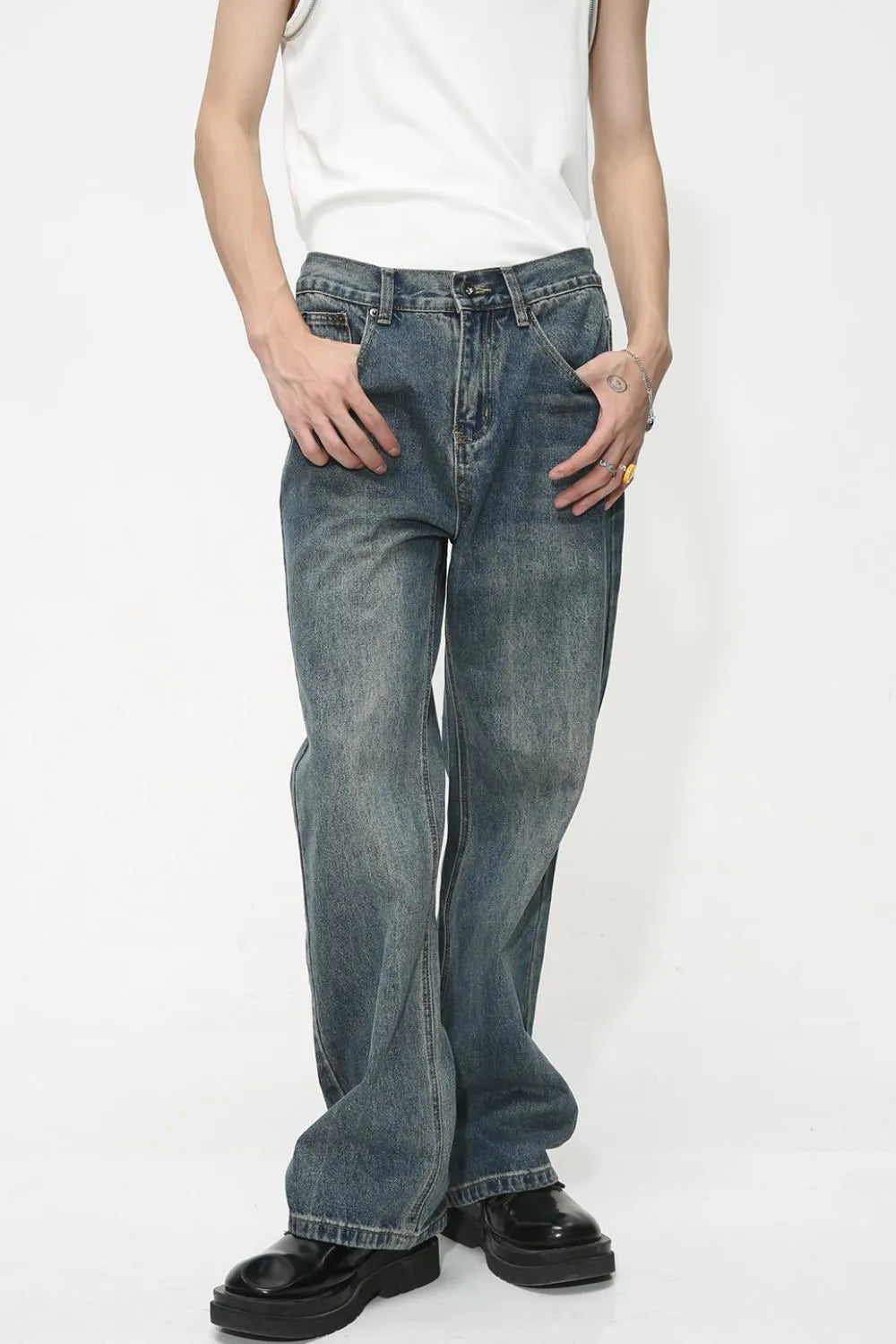 Baggy denim jeans in medium wash with subtle fading and a relaxed fit.