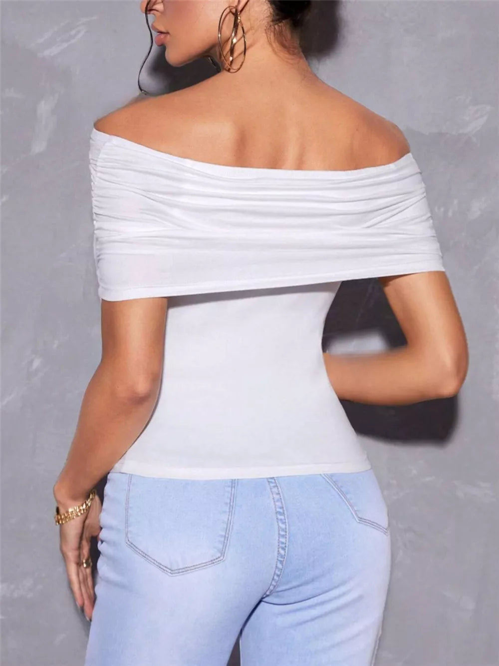 White off-shoulder ruched t-shirt with a fitted silhouette.