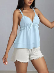 Light blue layered cami with lace trim, V-neck, bow detail, and ruffled tiers.