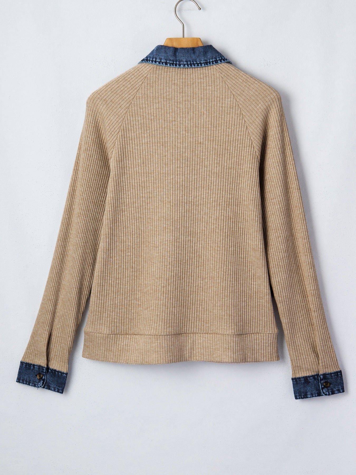 Beige ribbed knit shirt with denim collar and cuffs, long sleeves, buttoned detail.
