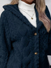 Navy hooded trench coat with button detail and textured fabric.