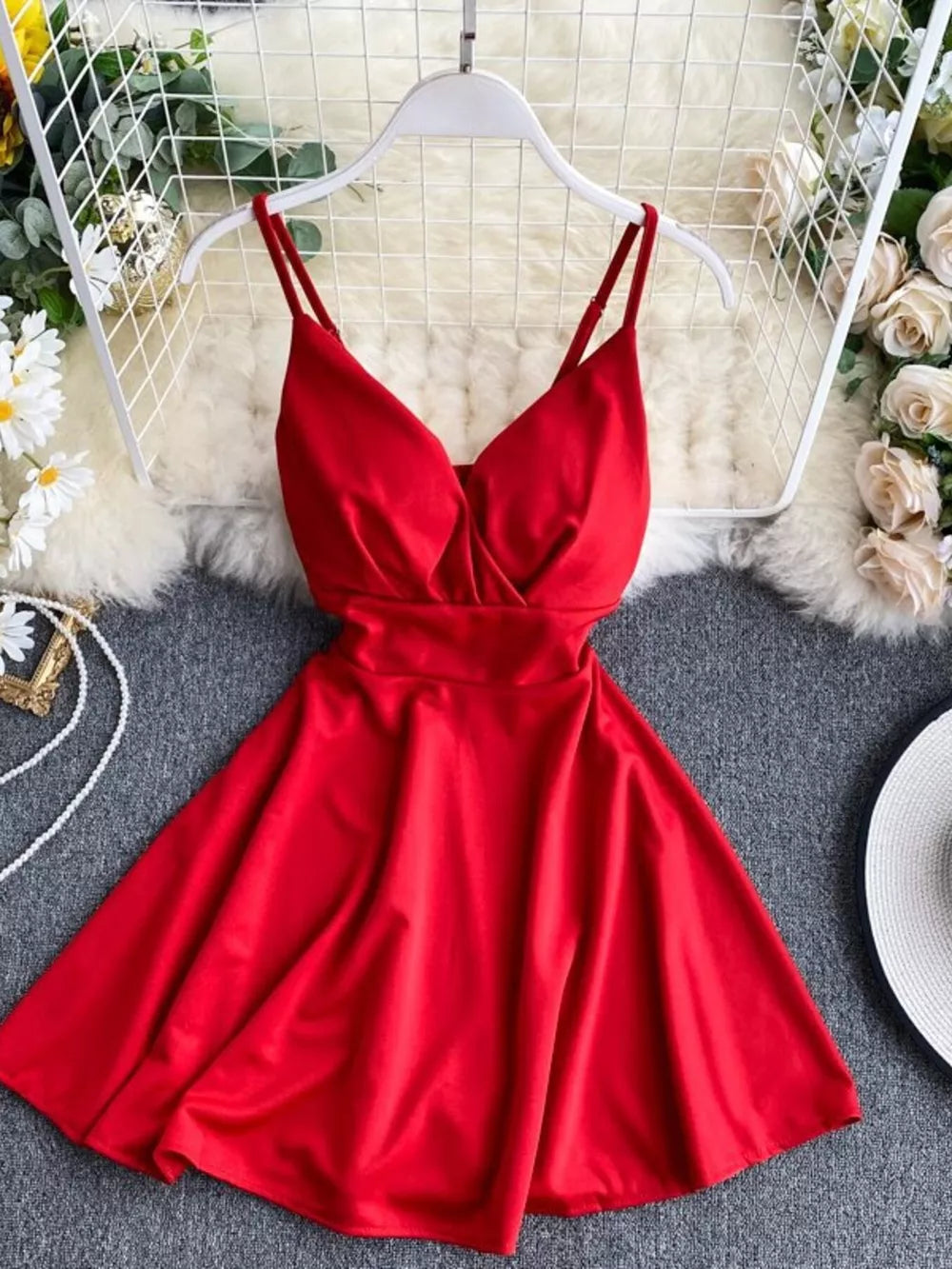 Red V-neck spaghetti strap mini dress with adjustable straps and a flared skirt.