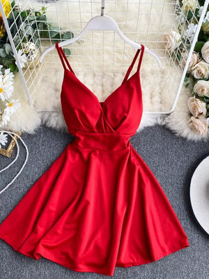 Red V-neck spaghetti strap mini dress with adjustable straps and a flared skirt.