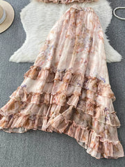 Floral ruffle set with bow detail in pink and light green, featuring a tiered skirt.