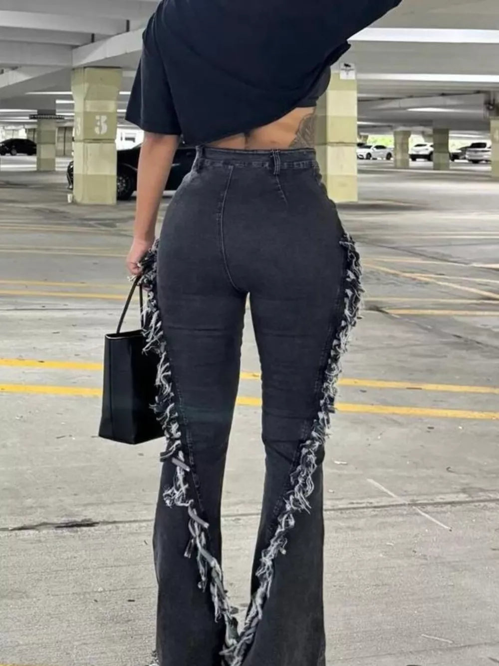 Frayed hem high-waist flare jeans in black gray with deconstructed side details.