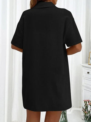 Black linen shirt with short sleeves and collar, part of a co-ord set.