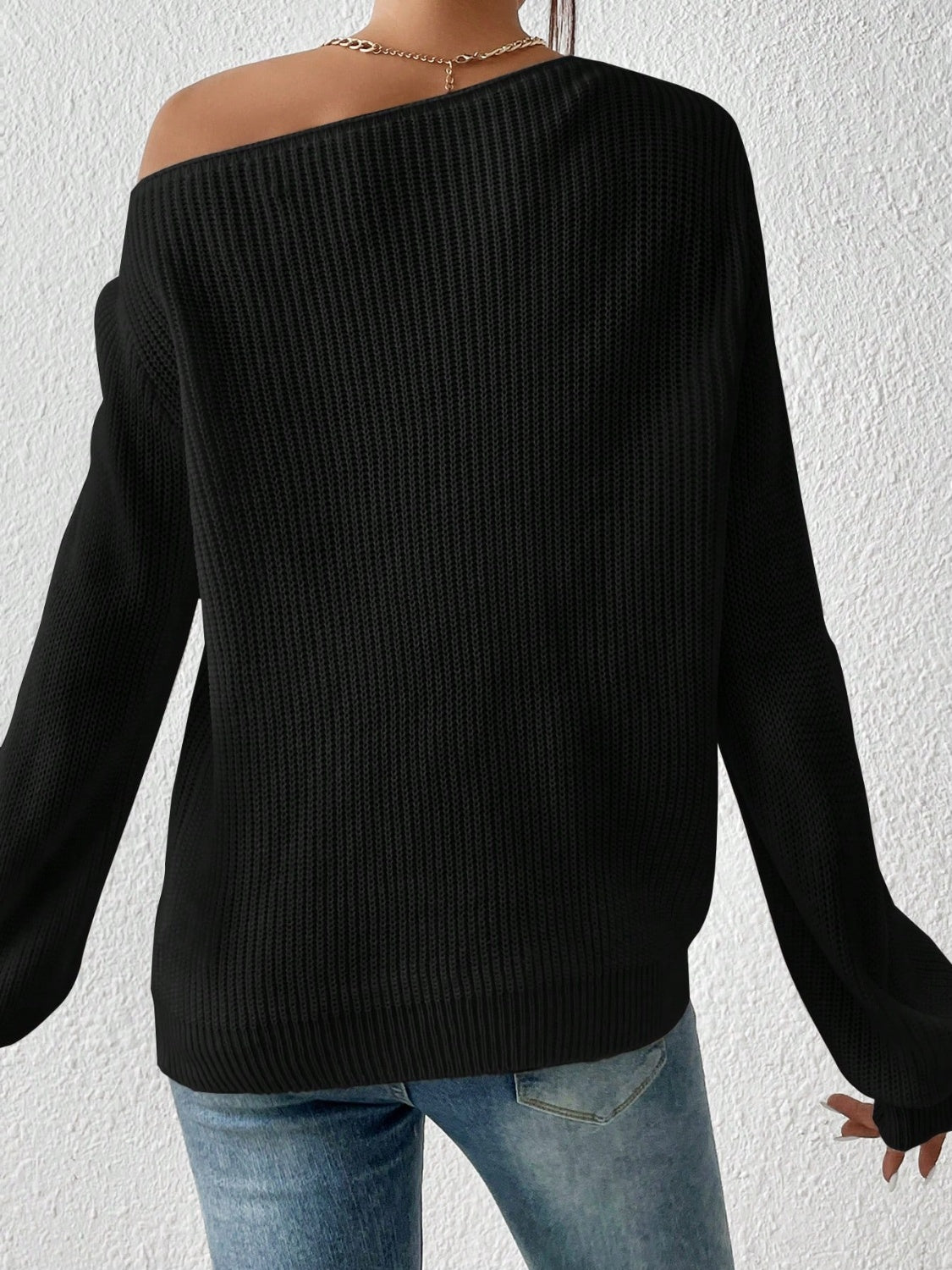 Black off-shoulder ribbed knit top with balloon sleeves and a casual fit.