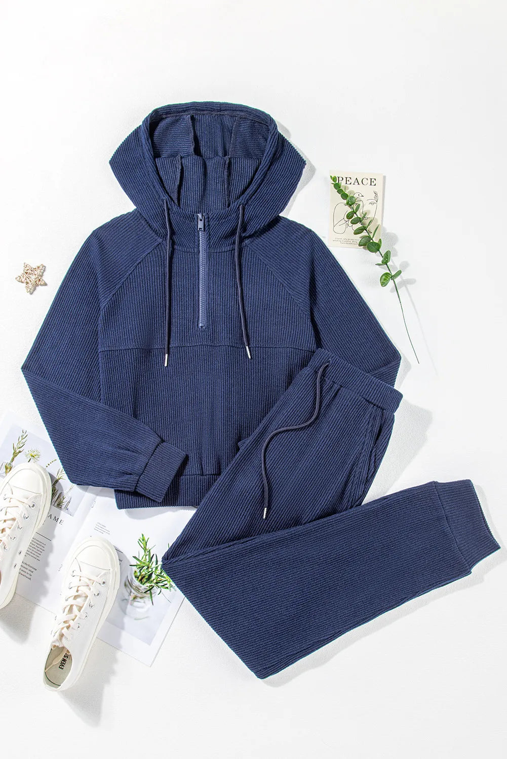 Navy ribbed crop hoodie with quarter zip and matching joggers.