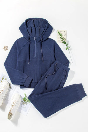 Navy ribbed crop hoodie with quarter zip and matching joggers.