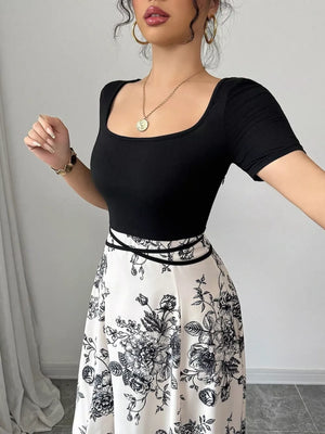 Chic floral maxi dress with square neckline and black and white floral print skirt.