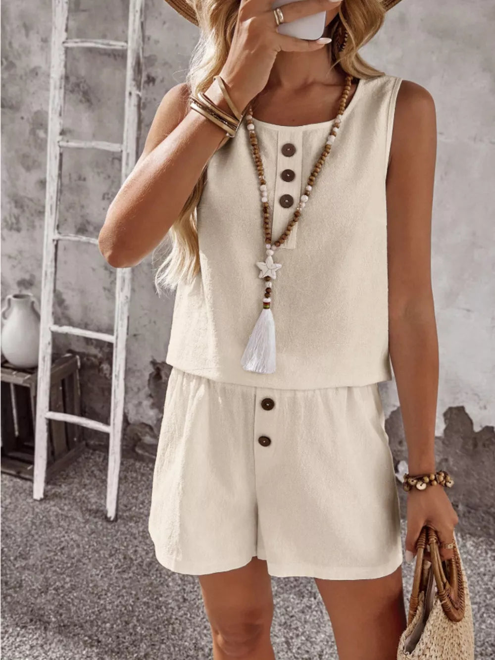 Apricot cotton two-piece set with decorative buttons on the top and shorts.