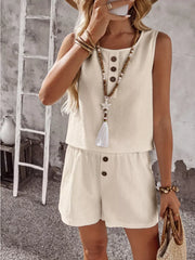 Apricot cotton two-piece set with decorative buttons on the top and shorts.