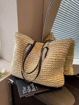 Natural woven straw shoulder bag with dark brown leather straps in khaki.