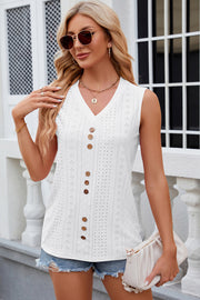 White perforated button-down sleeveless blouse with V-neck and wooden buttons.