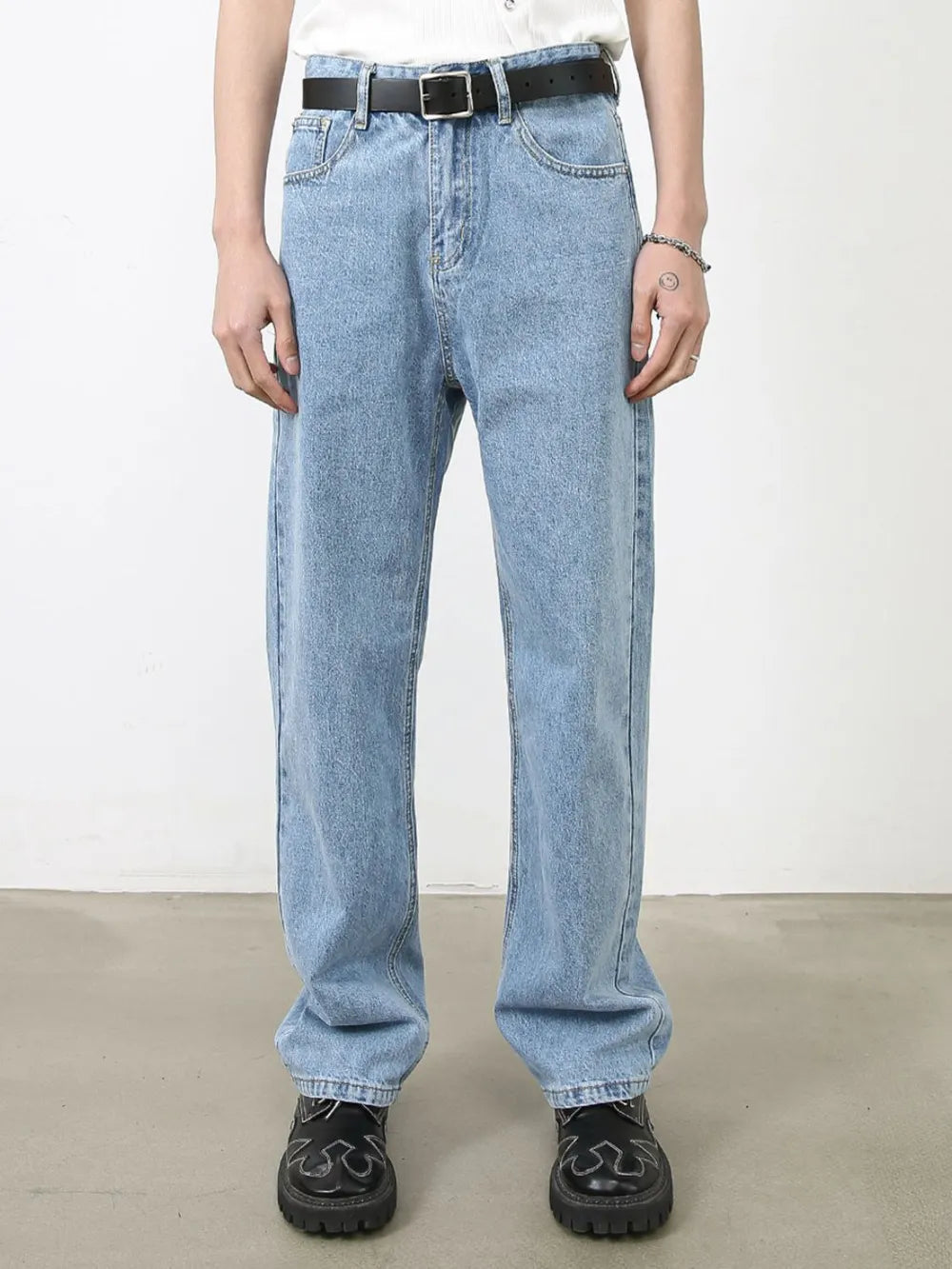 Light blue relaxed-fit denim jeans with subtle seam detail and a straight leg cut.
