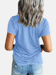 Light blue raglan pocket t-shirt with short sleeves and a casual fit.