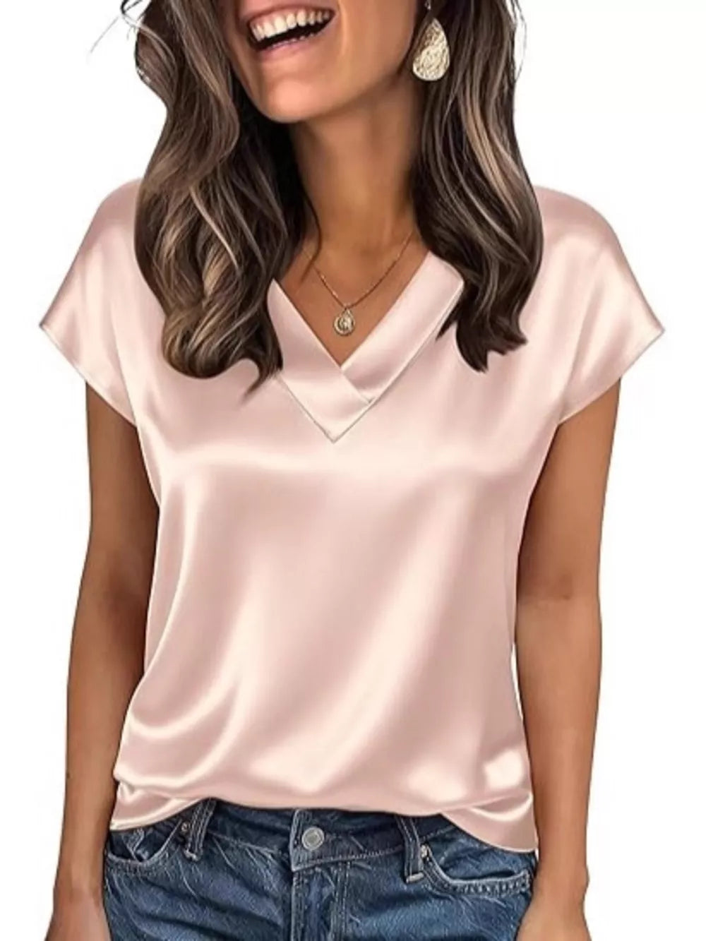 Luxe satin V-neck short sleeve maternity shirt in champagne color, styled with jeans.