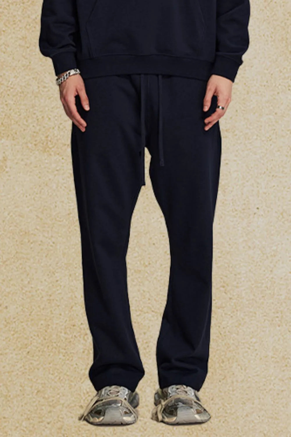 Navy relaxed fit lounge joggers with drawstring waist and cuffed ankles.