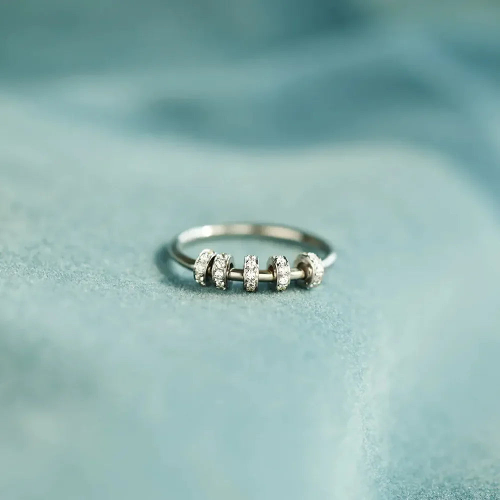 Sterling silver ring with five movable pavé-embellished beads.