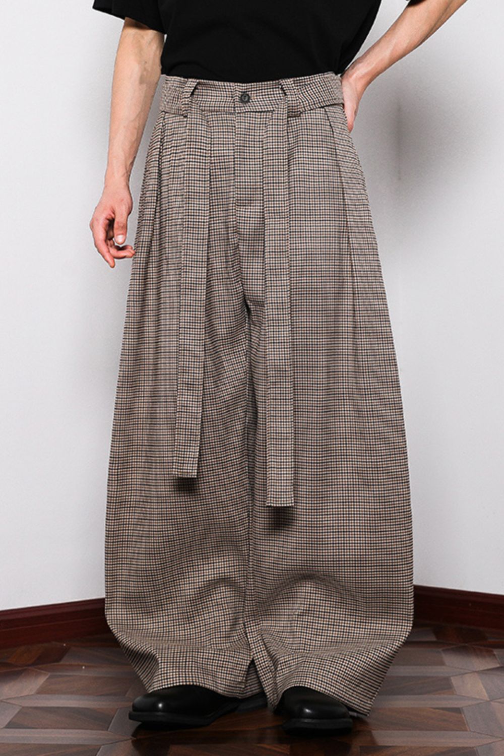 Men's belted wide leg plaid sweatpants in brown with a tie waist.