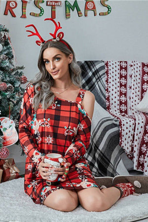 Cold shoulder red plaid dress with festive print, long sleeves, and a square neckline.