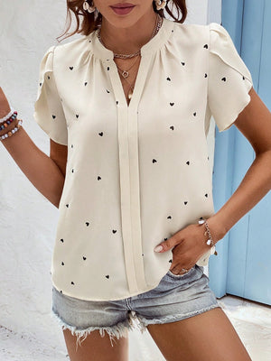 Cream heart print puff sleeve blouse with V-neck and gathered detail