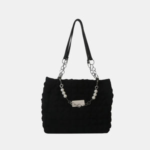 Black textured grid shopper bag with pearl and chain detail.
