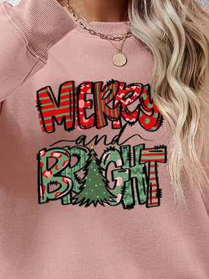 Blush pink crewneck sweatshirt with Merry and Bright graphic and Christmas tree detail.