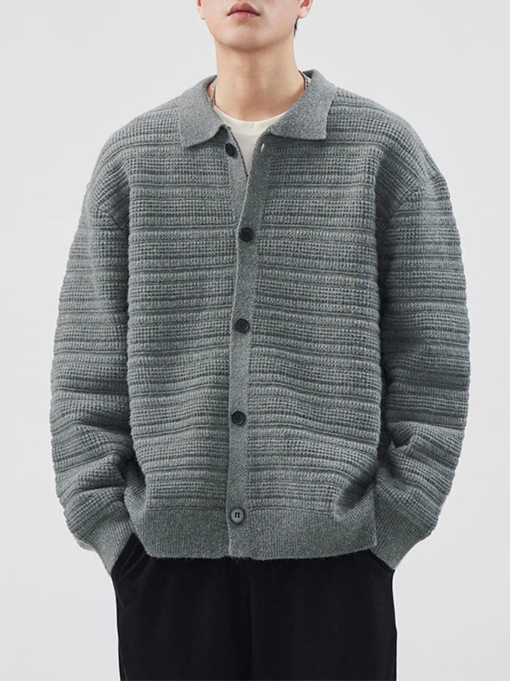 Men's gray ribbed knit button-down cardigan with a collar.