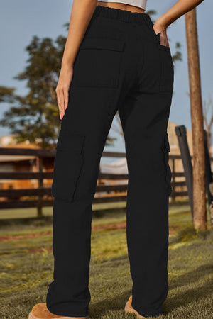 Black utility pocket denim cargo pants with a relaxed fit and elastic waistband.
