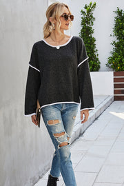 Oversized knit top in charcoal with white contrast trim and crew neck.