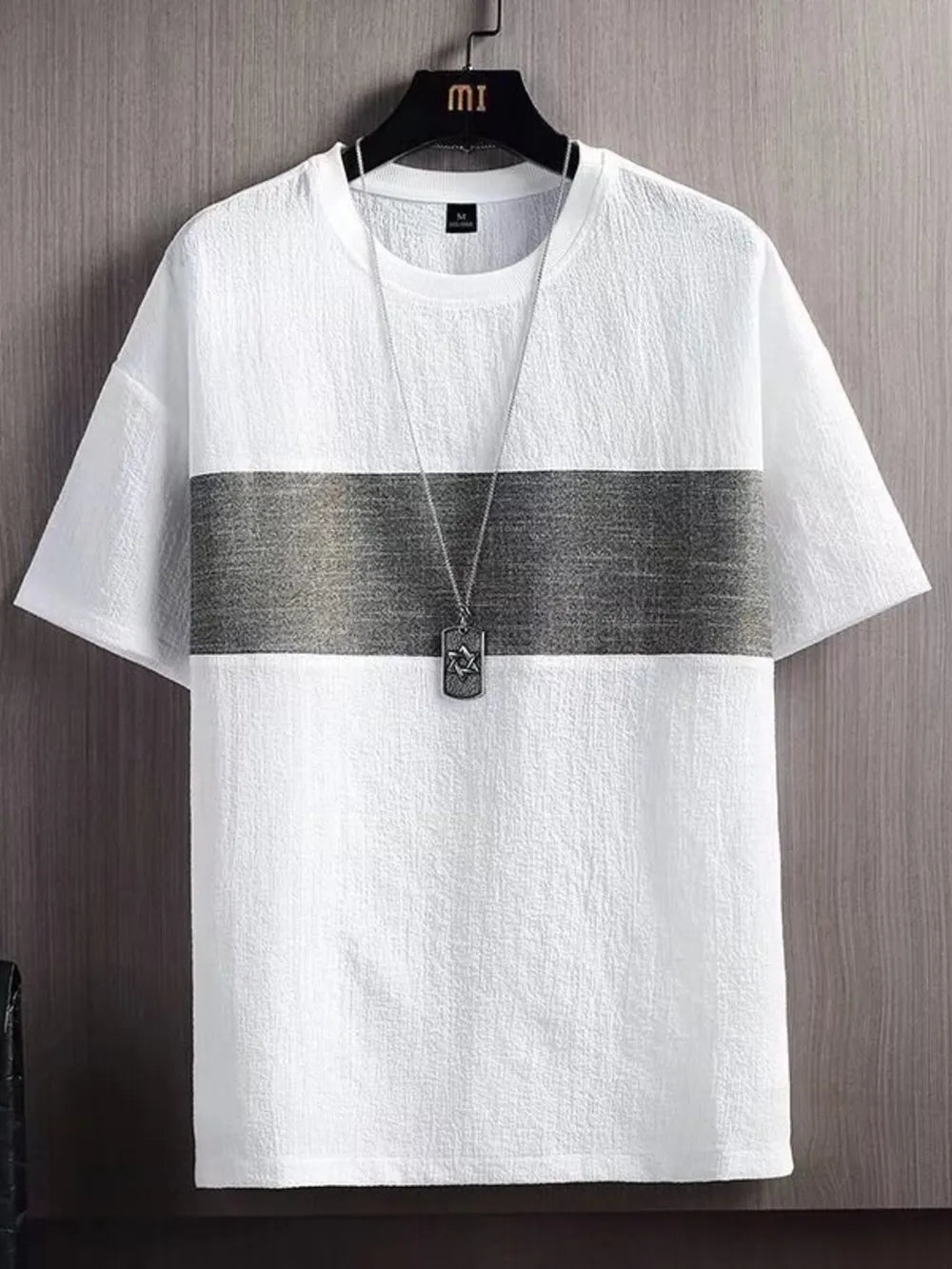 Textured white t-shirt with gray stripe detail and round neck.