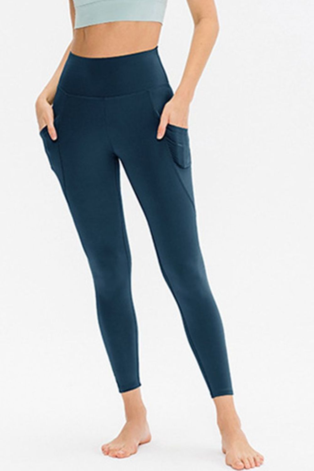Deep Teal Sculpted Pocket Performance Leggings with high waist and breathable fabric.