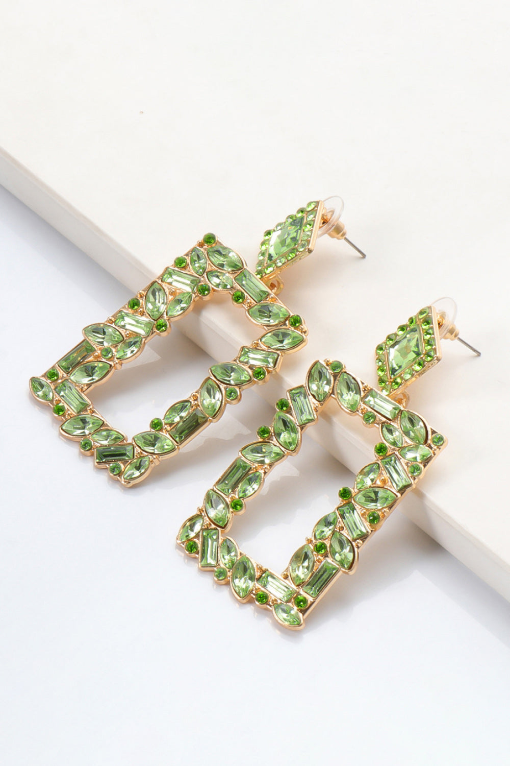 Light green geometric jewel box earrings with gold alloy setting and crystal accents.