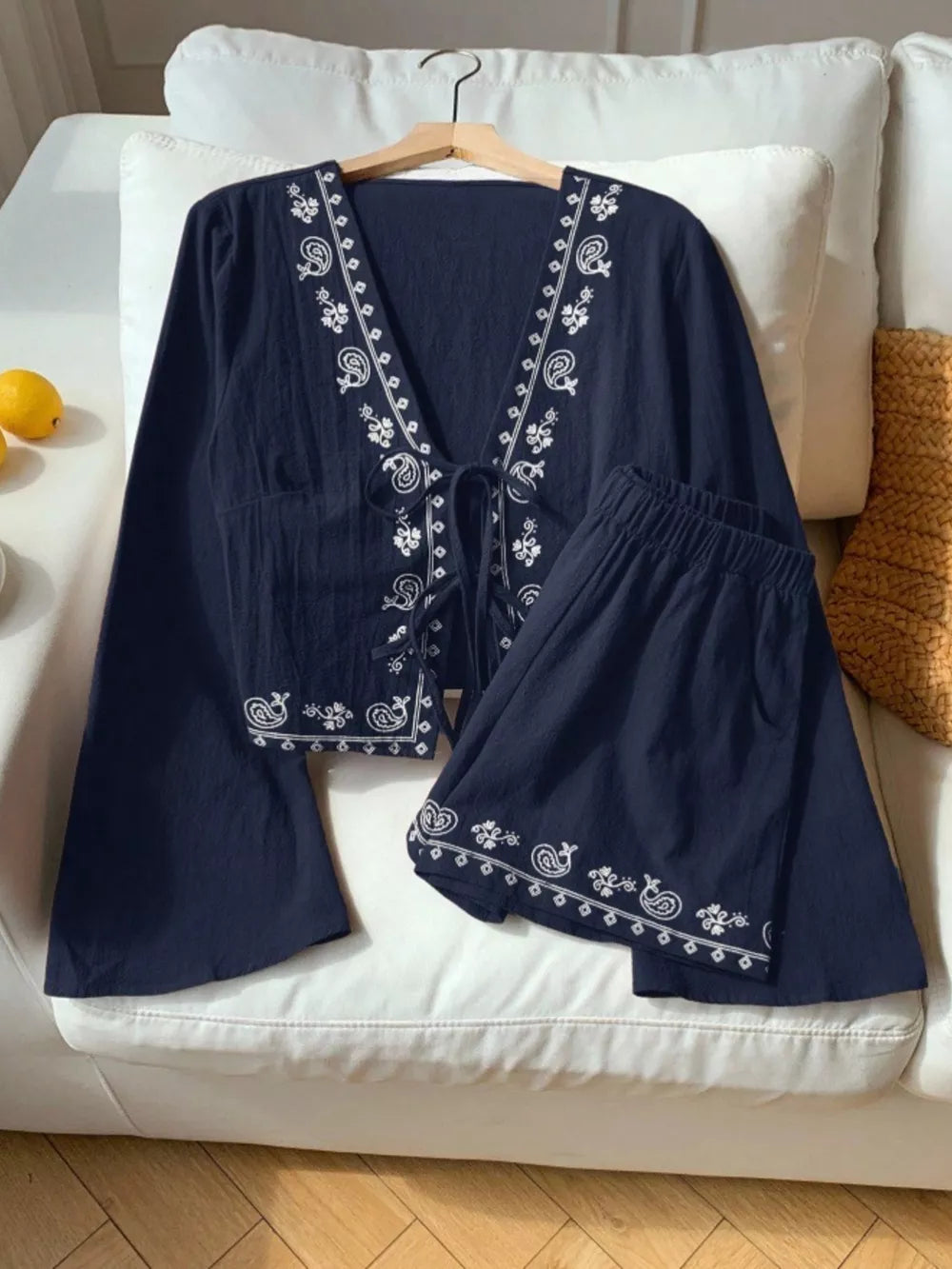 Navy embroidered tie-front top and shorts set with paisley details.