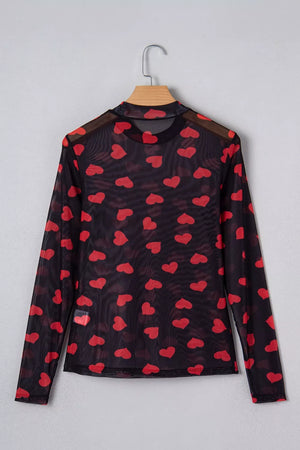 Black sheer mesh long sleeve top with all-over red heart print and mock neck.
