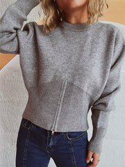 Gray ribbed zip-front knit sweater with a fitted hemline and crew neck.