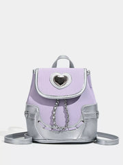 Charming mini heart flap backpack in purple with silver accents and chain detail.