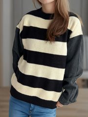 Striped knit sweater with black denim sleeves and crew neck.