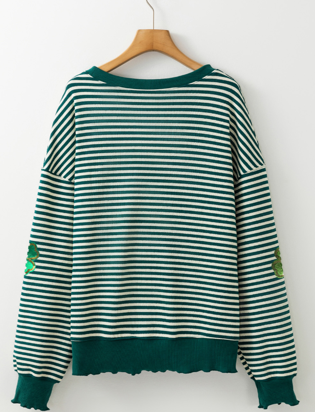Dark green and white striped boatneck pullover with clover appliqué detail.