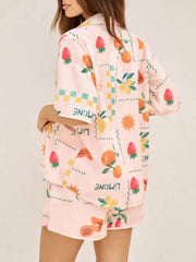 Pink co-ord pajama set with fruit print and button-up shirt