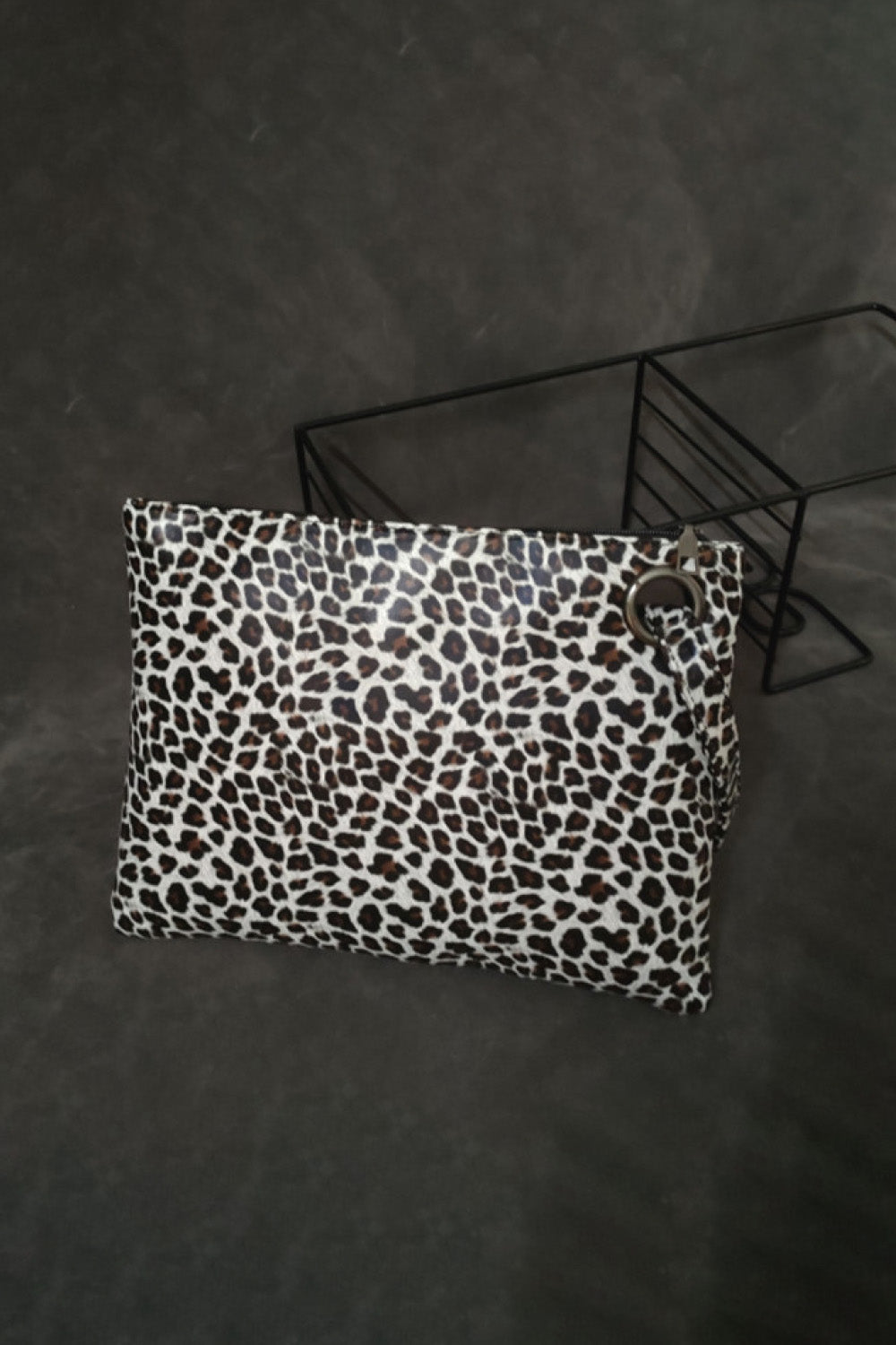 Leopard print clutch bag with zip top and ring detail